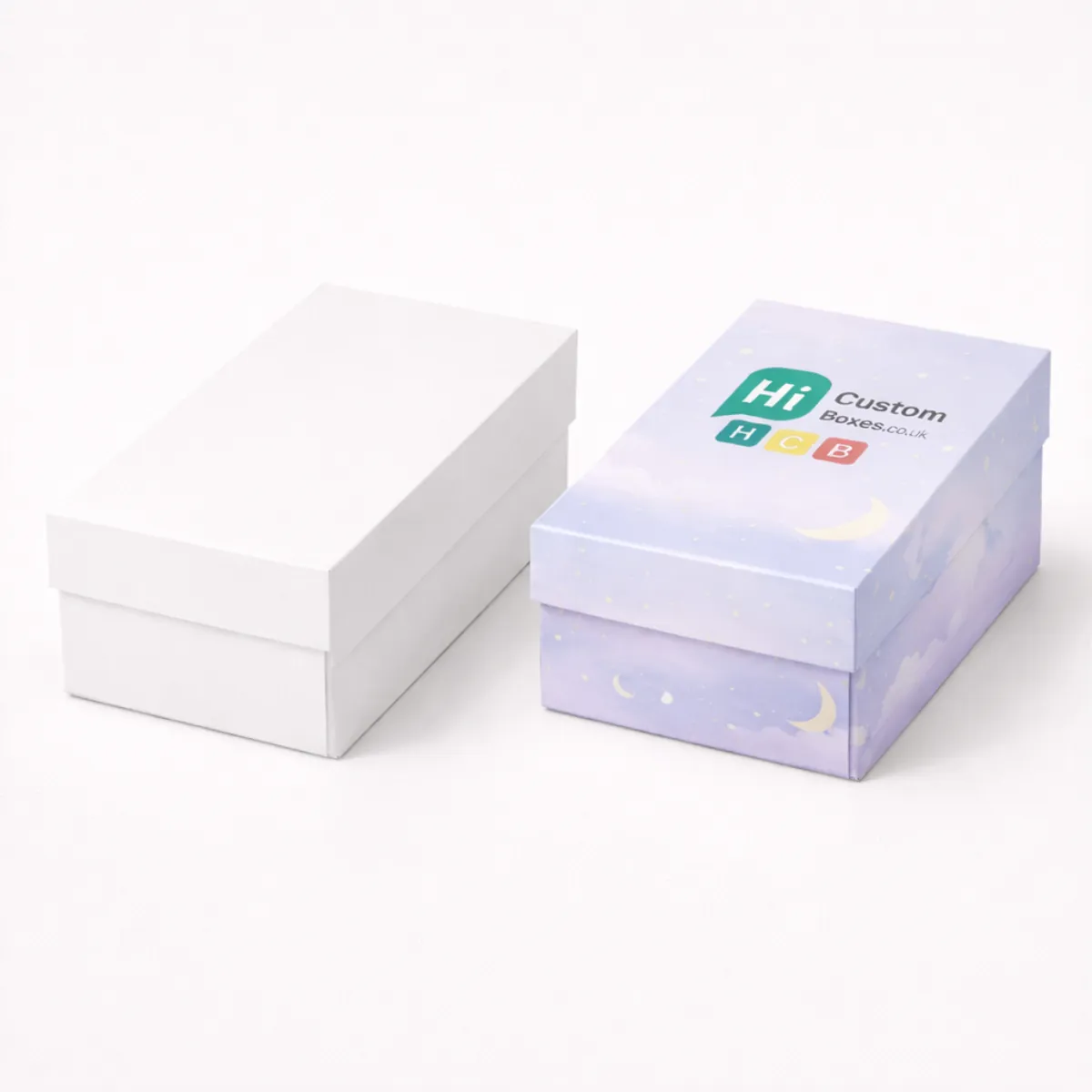 A plain white rectangular box next to a lilac box printed with clouds and stars- class=